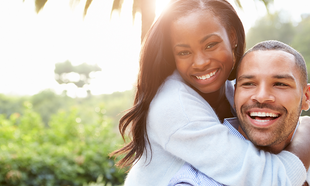 Portrait Of Loving African American Couple In Countryside. 